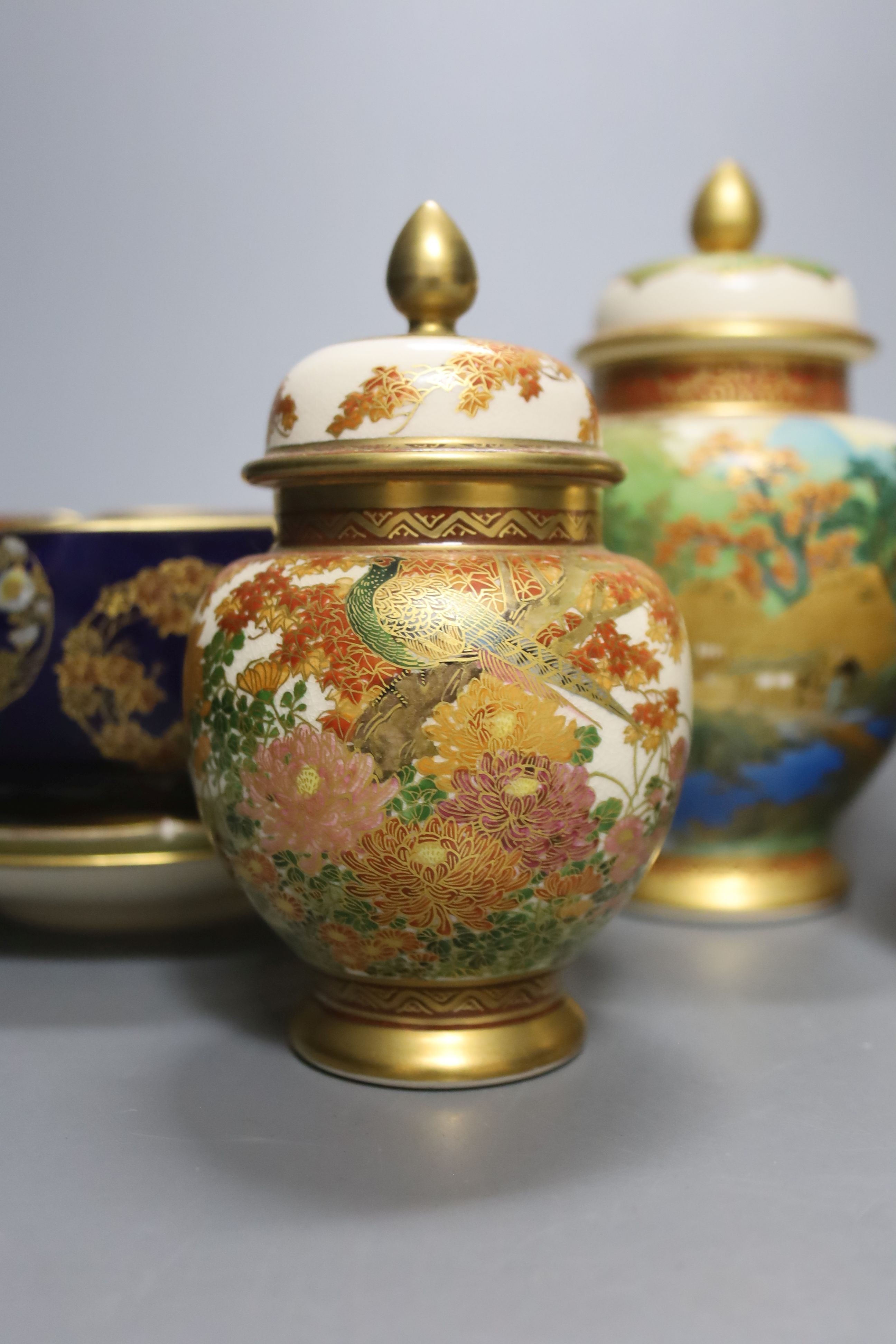 A collection of Japanese Satsuma, vases, bowls and lidded jars, 9 items in total, tallest item,18 cms high.